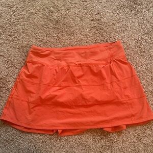 Lululemon coral tennis skirt.  Size 8.